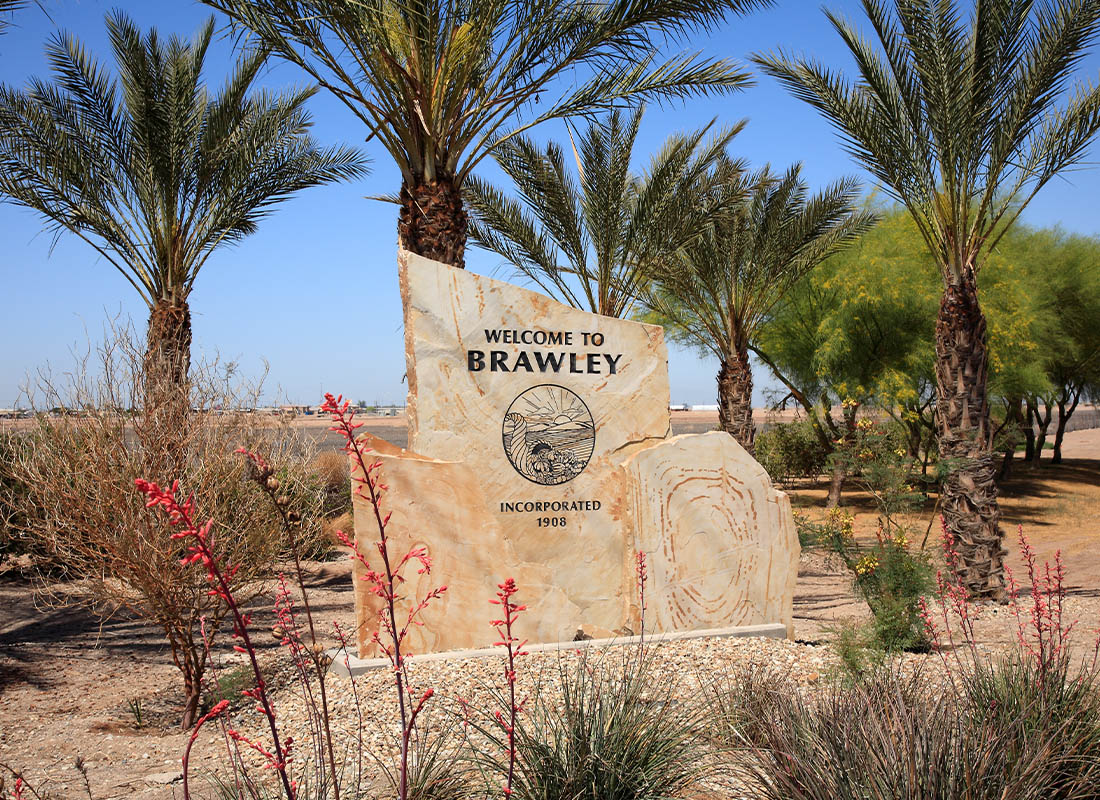 Auto and Home Insurance for Brawley, California - Welcome Sign and Trees in the Dessert of Brawley on a Sunny Day